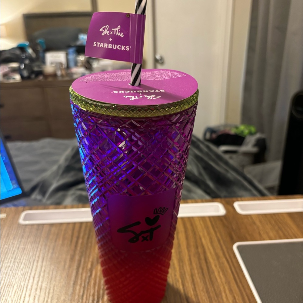 She/this Starbucks venti cup